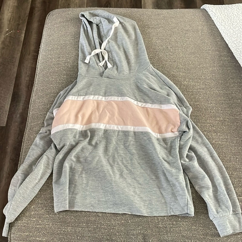 A supply grey and pink sweatshirt size small